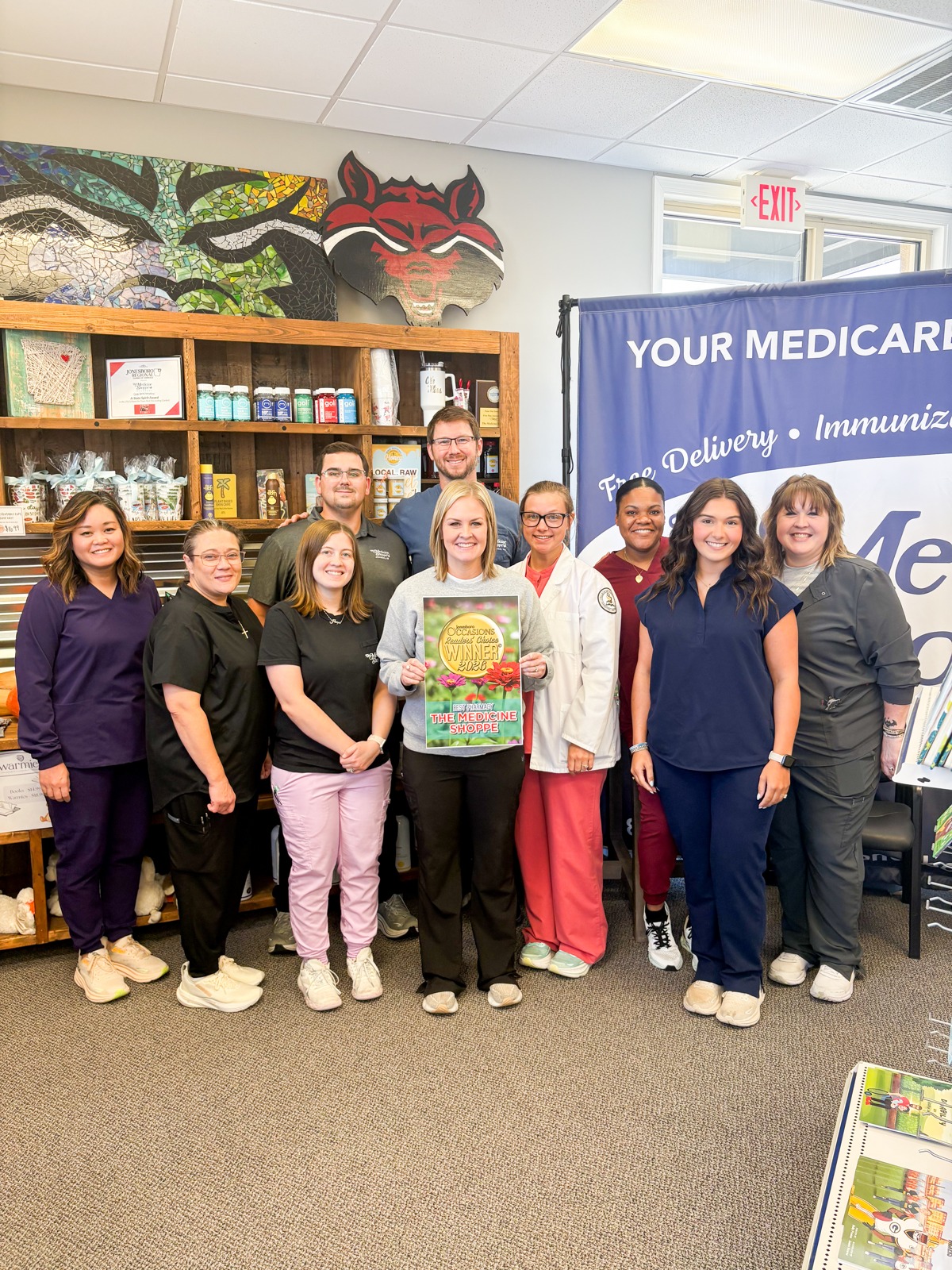 The Medicine Shoppe® Pharmacy team holding an Occasions award