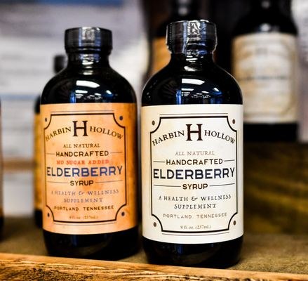 Elderberry syrup bottles on a shop display