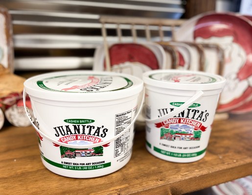 Juanita's Candy Kitchen tubs labeled cashew brittle